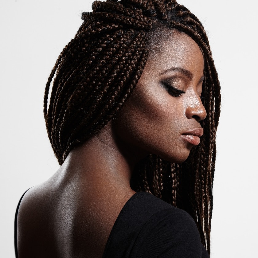black woman with braids and evening smokey eyes